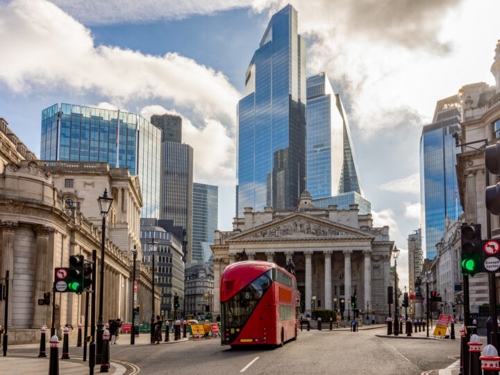 Royal Exchange building and skyscrapers in City of London, UK