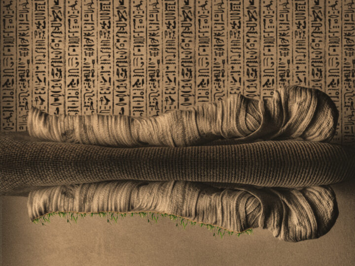 Ancient Egyptian mummy, partially wrapped in aged, textured bandages