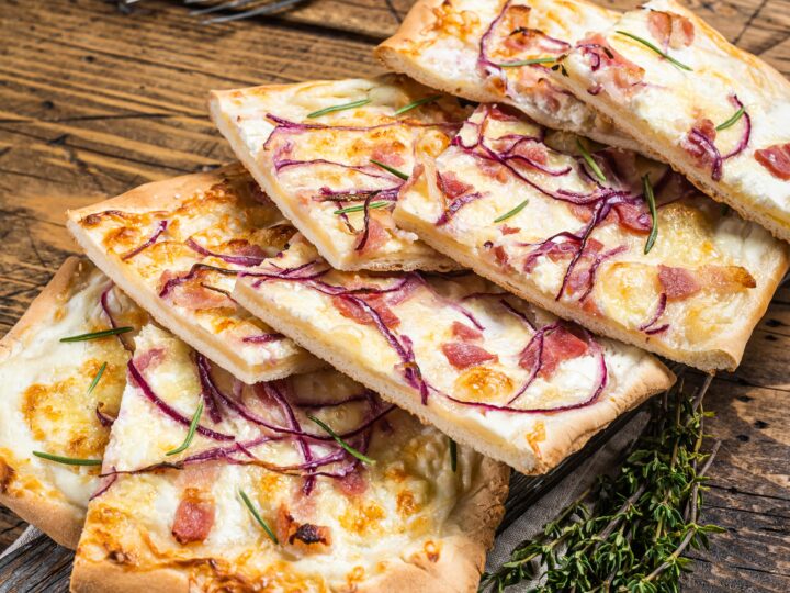 Flammkuchen or tarte flambee with cream cheese, bacon and onions